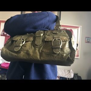 Women green leather handbag.